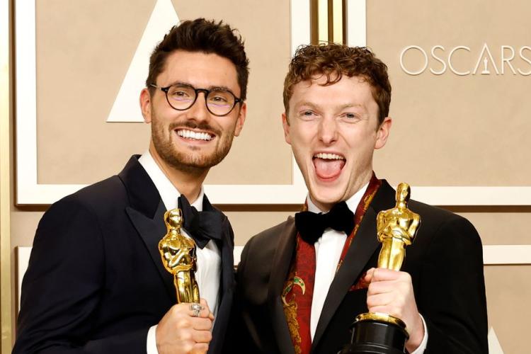 Tom Berkeley and Ross White holding their Oscar awards