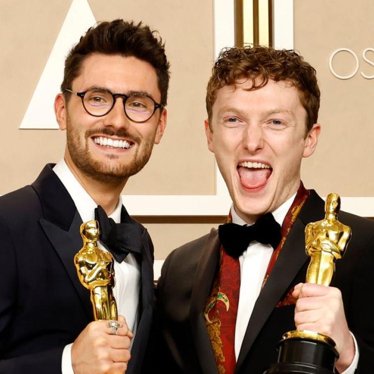Tom Berkeley and Ross White holding their Oscar awards